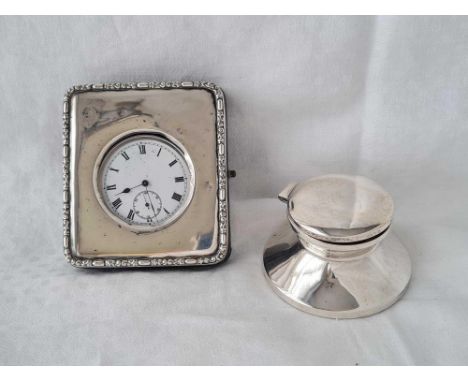 A travelling clock, silver mounted together with a pocket watch (not silver) and a Captains shape ink stand
