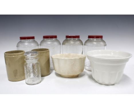 A quantity of vintage kitchenalia, including four glass jars with red lids, 20cm, two pottery moulds, two utensil jars, and a