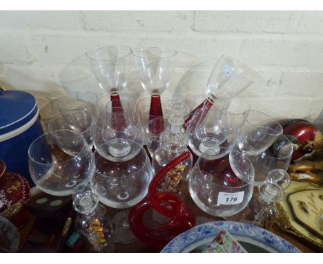 A Collection of Modern Ruby Glass Stemmed Wines and Other Glassware Including Glass Ships in Bottles