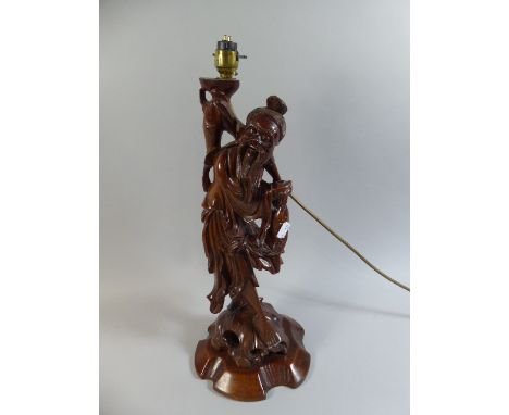 An Oriental Carved Root Wood Figural Table Lamp in the Form of Fisherman with Fish, 50cm High