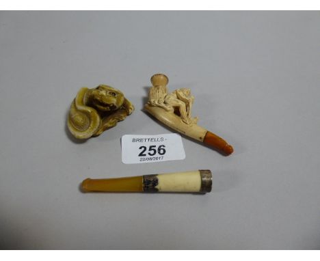 A Carved Meerschaum Cheroot Holder, Silver Mounted Cheroot Holder and Oriental Dragon Netsuke 