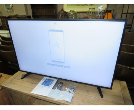 A SAMSUNG 42" FLATSCREEN TV WITH REMOTE, CABLE AND MANUAL