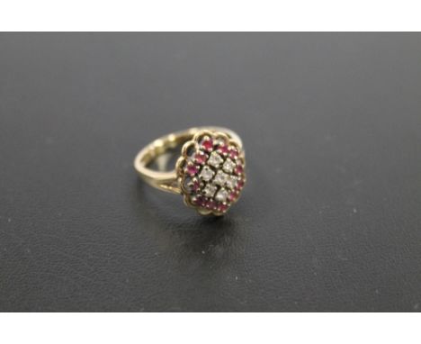 A HALLMARKED 9 CARAT GOLD RUBY AND DIAMOND CLUSTER RING  approx weight 3.6g 