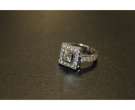 A HALLMARKED HANDMADE 18 CARAT WHITE GOLD DIAMOND RING, set with a central Princess cut diamond of an estimated 0.54 carat - 