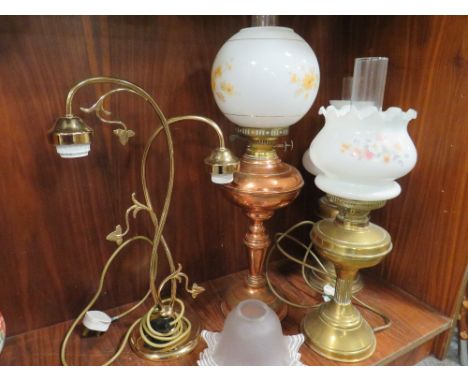 A SELECTION OF CONVERTED OIL LAMPS TOGETHER WITH A TWO BRANCH TABLE LAMP