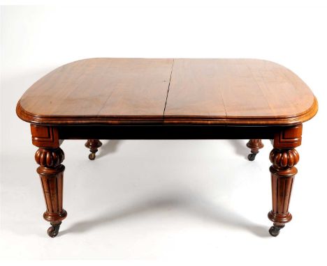 A good quality Victorian mahogany extending dining table, the stepped rounded rectangular top with three additional drop-in l