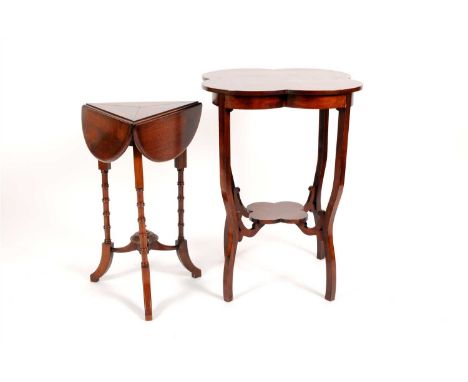 A Victorian mahogany folding occasional table with folding shaped top over turned ringed legs united by a pointed shallow car