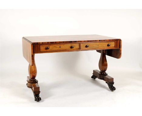 A large 19th century rosewood veneered sofa table, the rectangular top with hinged rounded sides above two real and two dummy