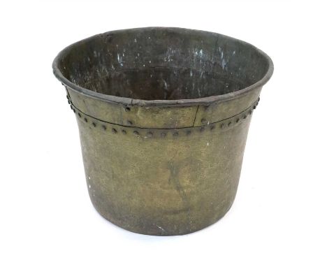 A large 19th century weathered riveted beaten brass hopper, the bell shaped bowl with a rolled flared rim and studded border,