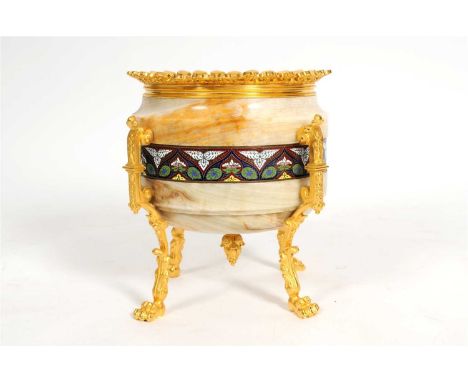A decorative French polished onyx jardinière, of cylindrical form with an enamelled border decorated with polychrome stylised