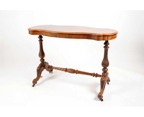 A Victorian walnut occasional / centre table, the shaped rectangular top in well matched quarter veneers with a bevelled top 