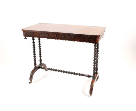 A Victorian rosewood veneered side table, the rounded rectangular top above a shaped apron frieze decorated with applied cabo