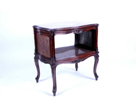 A French marble topped mahogany framed bergere panelled side table, the serpentine rectangular top with an inset stone panel 