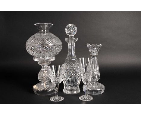 A collection of Waterford Crystal drinking and tableware including decanters and stoppers, a lamp base with shade, wines, tum