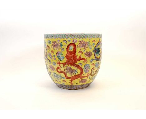 A Chinese porcelain nine dragon jardinière in the famille jaune palette, marked to underside, 28 cm high, 31 cm diameter, tog