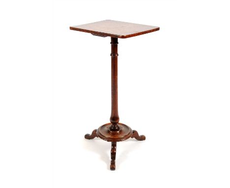 A small country oak occasional table, the rounded rectangular top raised on a tapering collared cylindrical stem above a step