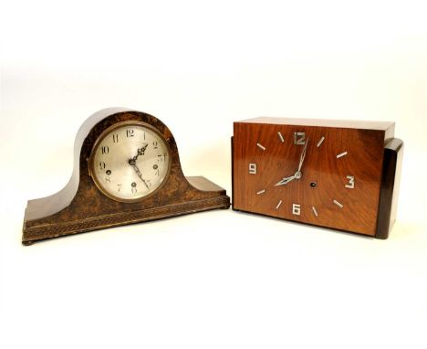 An Art Deco walnut veneered mantle clock, the rectangular face with applied chrome Arabic numerals flanked by stepped sides, 