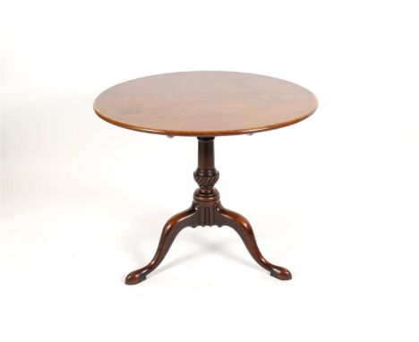 A George III mahogany snap-top tripod table, the circular top from from a single piece of mahogany, on a locking platform abo