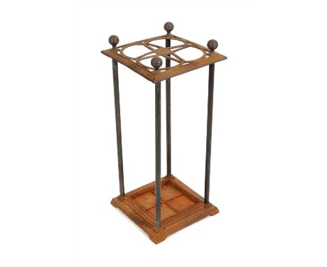 An Edwardian umbrella / stick stand, with a pierced and incised cast iron top plate centred with a floral motif cornered with