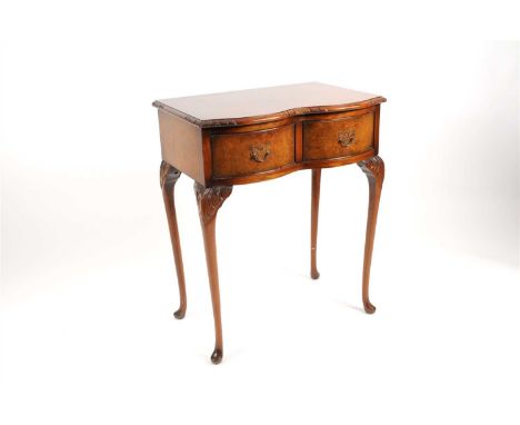 A small serpentine-fronted Queen Anne style side table, mahogany framed and principally veneered in burr walnut, the quarter 