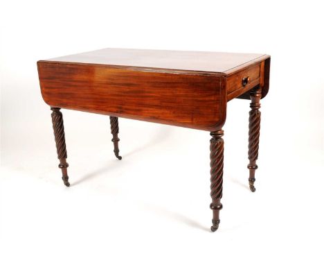 A Victorian mahogany pembroke table, with hinged rounded sides, one real and one dummy frieze drawers fitted with turned maho