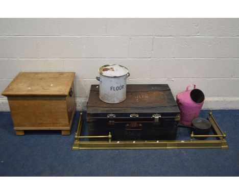 A VINTAGE TIN TRUNK, along with an extending brass fender, enamelled flour bin, painted bucked, pan and a pine commode (6)