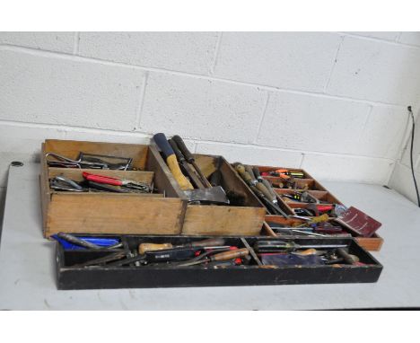 FOUR WOODEN TRAYS CONTAINING VINTAGE TOOLS including awls, chisels, gouges, files, etc