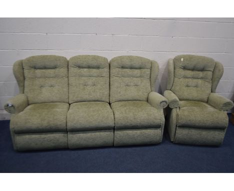 A GREEN UPHOLSTERED TWO PIECE LOUNGE SUITE, comprising a three seater settee and a manual reclining armchair (2)