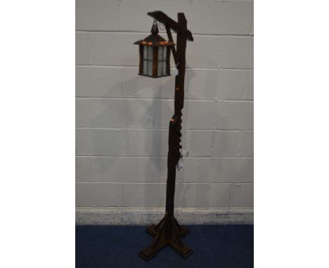 A REPRODUCTION OAK LANTERN, height 165cm