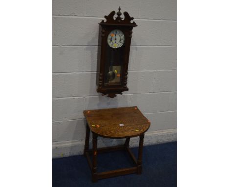 AN OAK DROP LEAF OCCASIONAL TABLE and an oak wall clock (2)