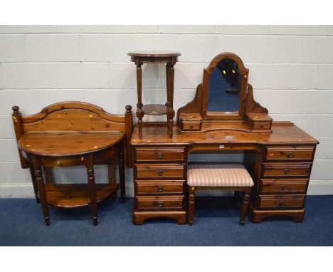 A DUCAL PINE DRESSING TABLE with a separate swing mirror and eight drawers, width 147cm x depth 45cm x height 138cm,  strippe