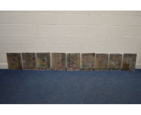 A SET OF NINE LIGHT GLAZED WINDOW LIGHTS, one window with central flower, each 43cm x 33cm (some windows distressed and ideal