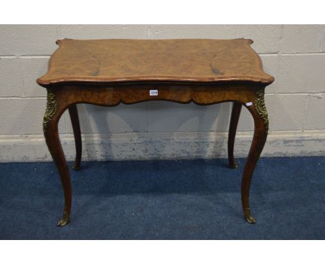 A VICTORIAN BURR WALNUT AND ROSEWOOD CROSSBANDED CARD TABLE, the serpentine fold over top enclosing a green baize interior, c