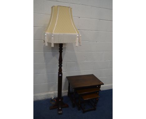 AN OLD CHARM OAK STANDARD LAMP, with a gold fabric shade, height including shade 183cm and an oak nest of three tables (2)