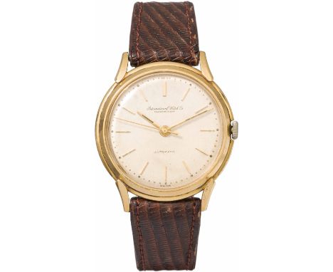 IWC SchaffhausenArmbanduhr1960/70er Jahre18kt Gold; Kunststoffglas, champagnerfarbenes Zifferblatt; Goldgehäuse, Krone wohl s