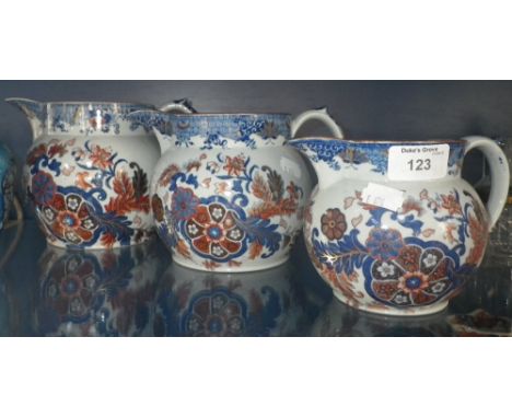 A graduated set of three Spode jugs with floral printed decoration 