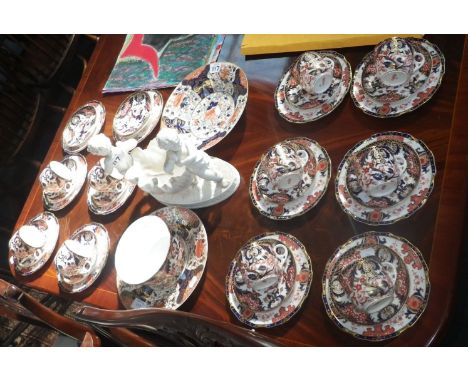 A collection of 19th century Derby teaware and a ceramic centrepiece decorated with cherubs  