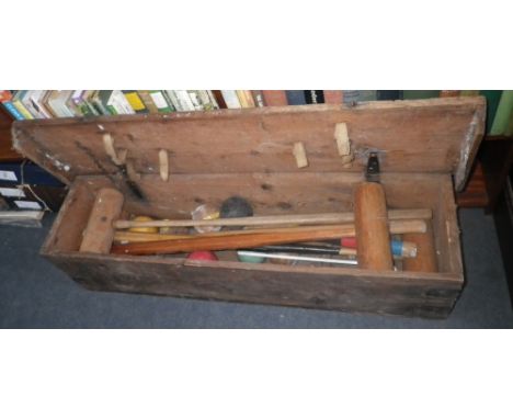 A vintage croquet set in a pine box  