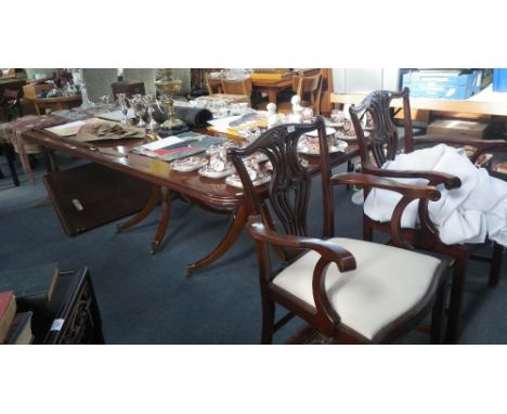 A pair of reproduction mahogany Chippendale style open arm chairs with cream drop in seats and a similar triple pedestal maho