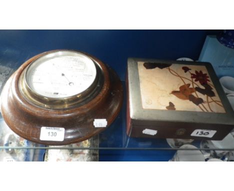 An Aneroid barometer and a lacquered box 