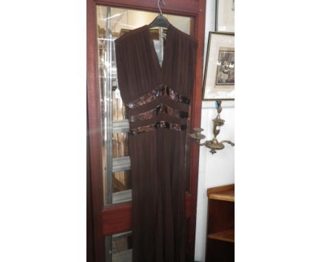 A vintage full length 1930's crepe evening dress in brown with applied sequins  