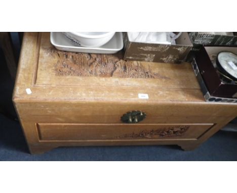 A camphorwood trunk with carved decoration  