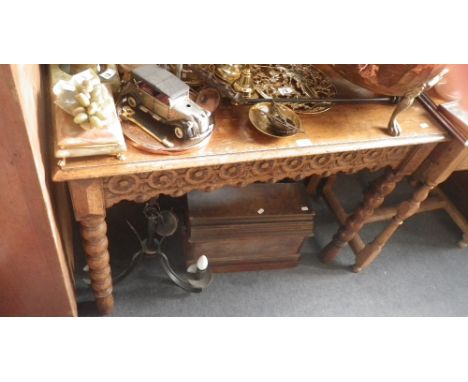 A Victorian light oak hall table with carved decoration  