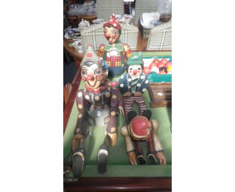 A hand painted Balinese wooden Pinocchio puppet and a collection of others similar  