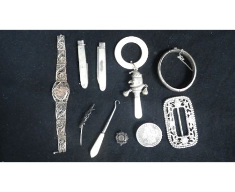 A silver plated child's teether in the form of 'Punch' with mother-of-pearl handle, a silver bangle and other silver jeweller