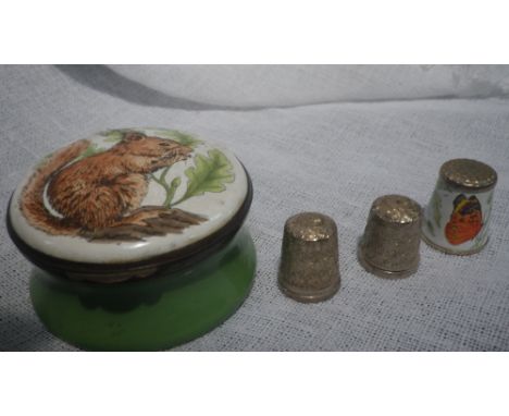 A Crummles enamel box depicting a squirrel and three thimbles 