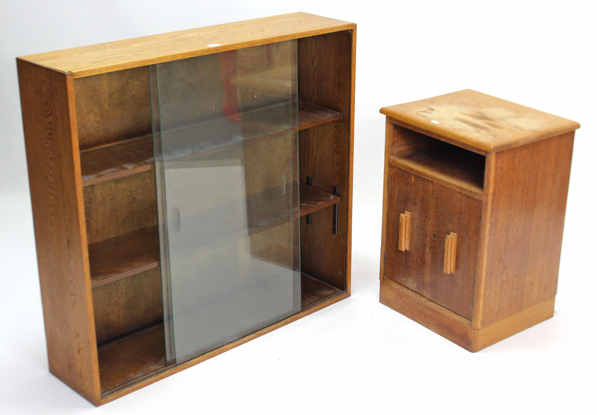 A small oak standing bookcase with two adjustable shelves ...