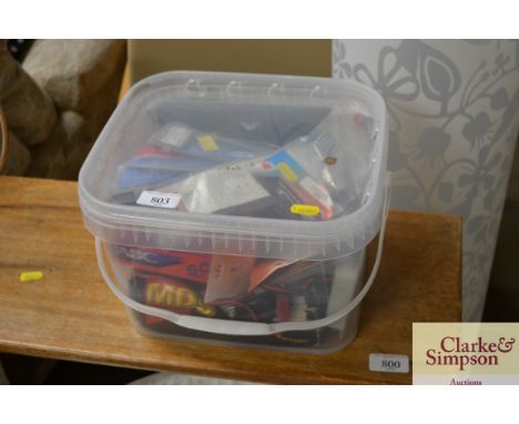 A box containing model aeroplane engine, props and parts