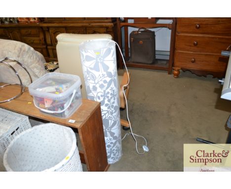 A plastic floor standing lamp