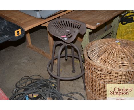 A reproduction tractor seat stool